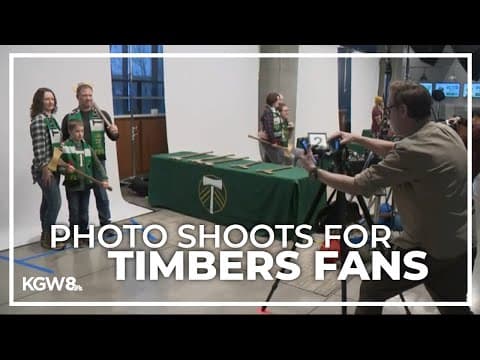 Timbers fans pose with team's iconic ax for stadium arch display