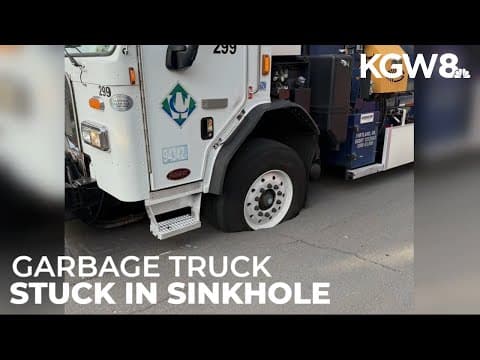 Garbage truck gets stuck in sinkhole in North Portland