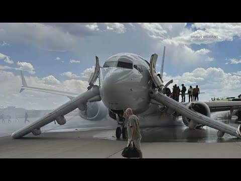 Passengers evacuated from American Airlines flight at Denver airport after problem with tire