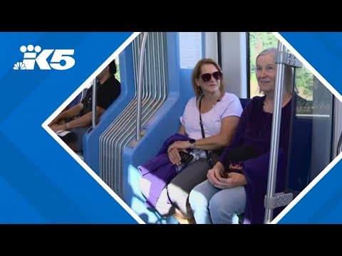 UW football fans pack trains, taking advantage of extension to Lynnwood