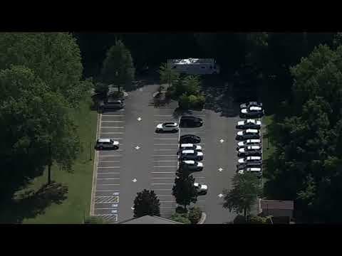 Live now: Police appear to be searching area near school in Manassas Park