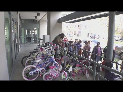 The Powder Room Nail Salon hosts toy giveaway, almost 65 bikes were given away