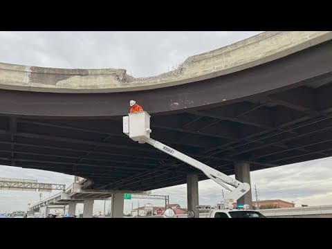 Vehicle crashes through barrier, lands on Southwest Freeway heading inbound near Beltway 8