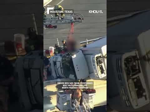 Video shows driver being pulled from box truck hanging off Texas overpass