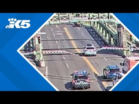 Driver fleeing police jumps partially-open University Bridge