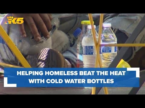 Helping homeless beat the heat by getting cold water bottles straight into their hands