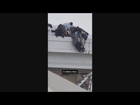 Strangers save Texas deputy dangling on overpass after crash
