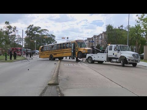 Spring Branch ISD school bus with students inside flips on its side