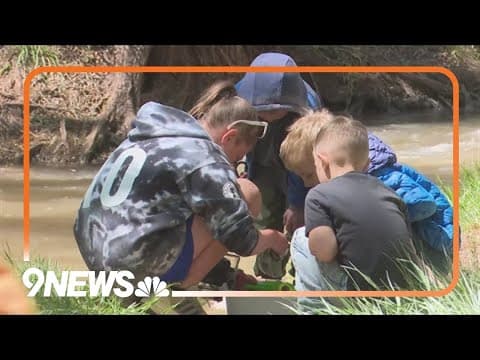 Colorado elementary school students help release fish back into the environment