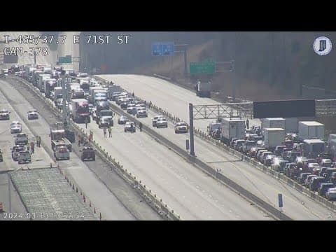 Downed power lines temporarily shut down all lanes of I-465 on Indy's northeast side
