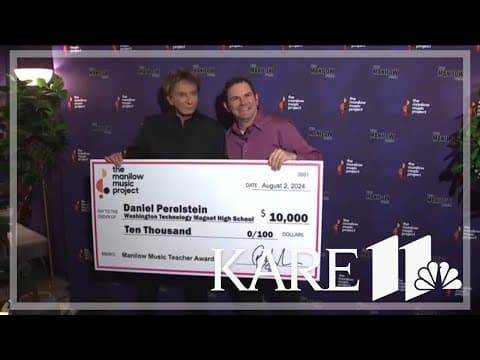 Barry Manilow presents grant to a St. Paul music teacher