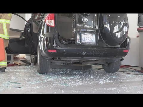 Woman crashes car through National City tire shop; 3 people injured