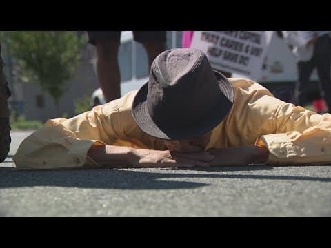 Protesters sit in the middle of street to call out DC leaders over poor living conditions for senior