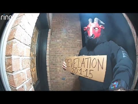 Unknown man wearing satanic mask, holding sign with apocalyptic Bible verse stuns Texas neighbors