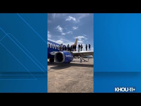 Watch: Cabo-bound passengers take emergency slide off Southwest plane in Houston