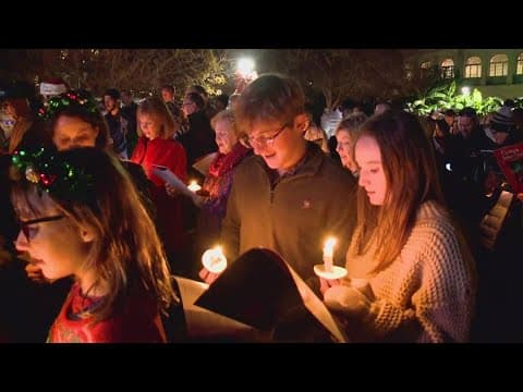 Carolers gather in Jackson Square