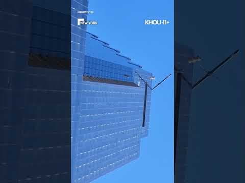 78 stories high, window washers were rescued from a building in NY