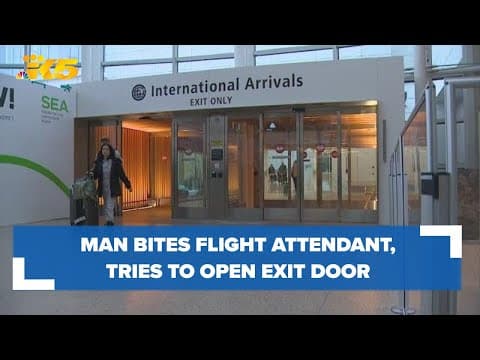 Man bites flight attendant, tries to open plane's exit door on flight to Seattle