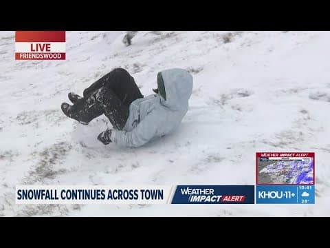 Houston-area residents go sledding as snow continues to fall