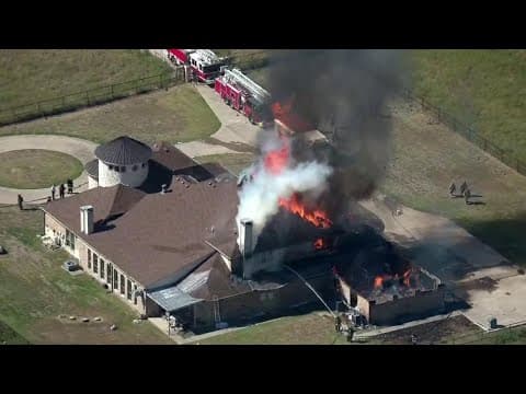Heavy fire burning at a mansion in North Texas