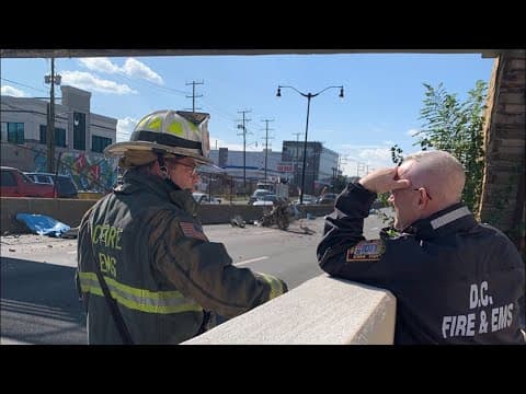 Firefighters evaluating pedestrian bridge on DC 295 after it was hit by debris from a passing vehicl