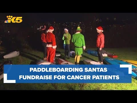 Paddleboarding Santas take to Lake Washington to raise money for people battling cancer