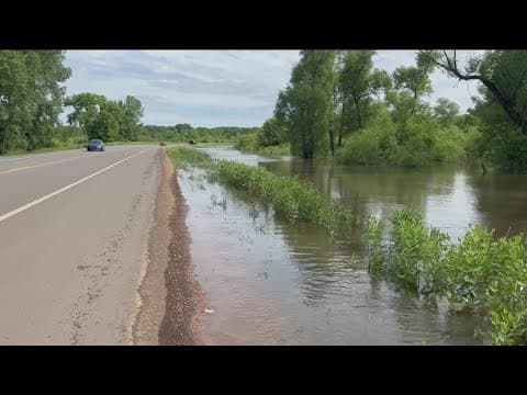 Minnesota River floods, closing roads in Carver County