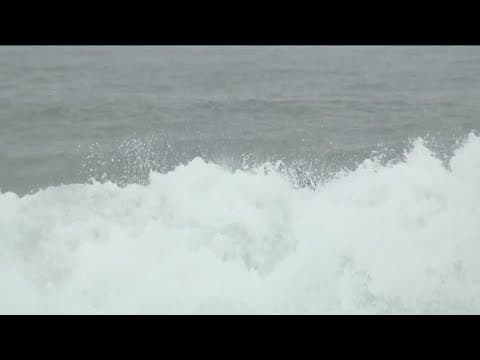 Powerful storm leaves San Diego roads drenched in rain with pier-towering surf