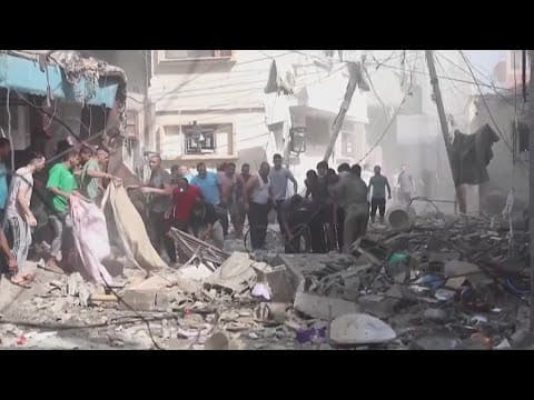 Israel delays ground invasion as rockets continue to pound Gaza