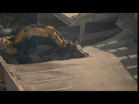 Crews demolish Terminal C parking garage at DFW Airport