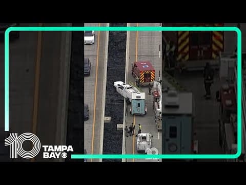 Truck’s front end hangs over Sunshine Skyway Bridge barrier after crash