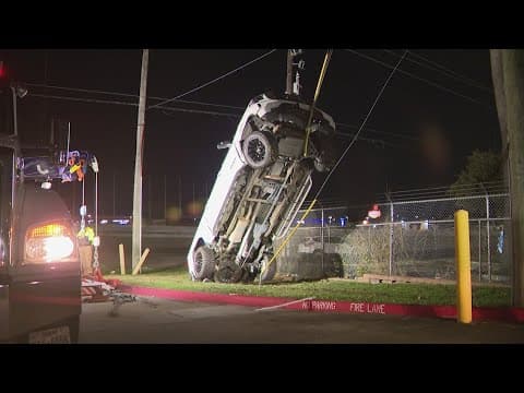 Pickup truck lands on guard cable just off I-45