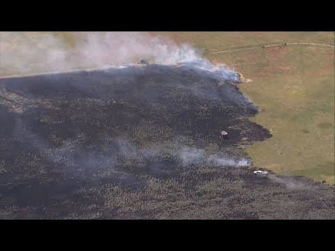 WATCH: Grass fire burning near Barr Lake in Brighton