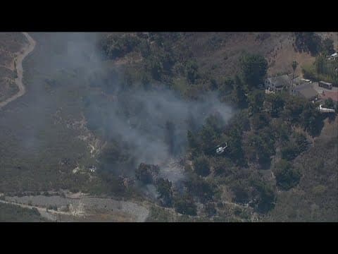Firefighters battle brush fire burning in Oceanside near 2800 Industry Street