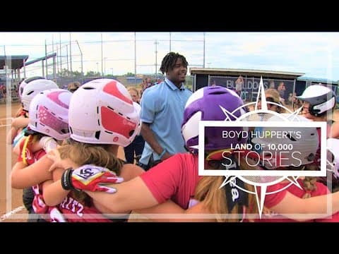 Cheerleading, backflipping, umpire is the talk of Minnesota youth softball