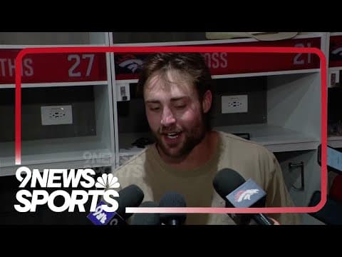 Broncos cornerback Riley Moss celebrates first career interception