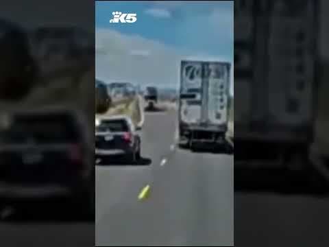 Oregon driver has close call squeezing between semi trucks