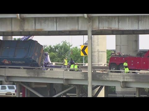 Truck crash leaves garbage truck dangling over I-10 ramp in New Orleans