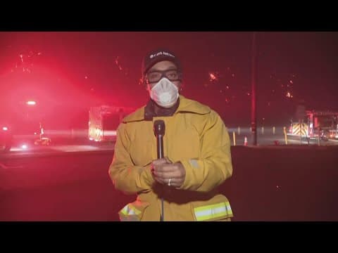 Destructive wildfires tear through Southern California, strong winds make it difficult to fight