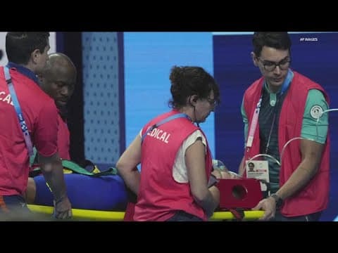 Olympic swimmer collapses poolside during competition