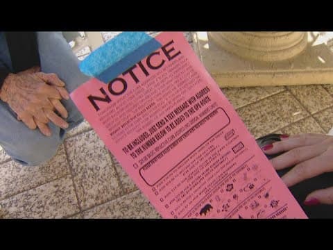 What are the curb painting flyers being taped on San Diego residents' trash cans?