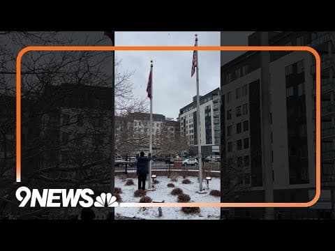 Snow falls in downtown Denver