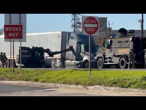 Video shows SWAT team work to get big rig driver out of cab after chase