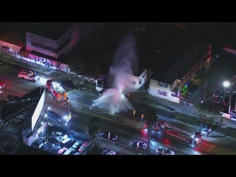 Water spews from hydrant damaged in crash in Los Angeles