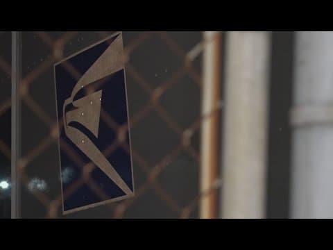 Dozens of postal workers protest the dismantling of USPS