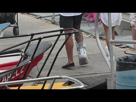 Cowboys QB Dak Prescott seen in a boot during summer off-season