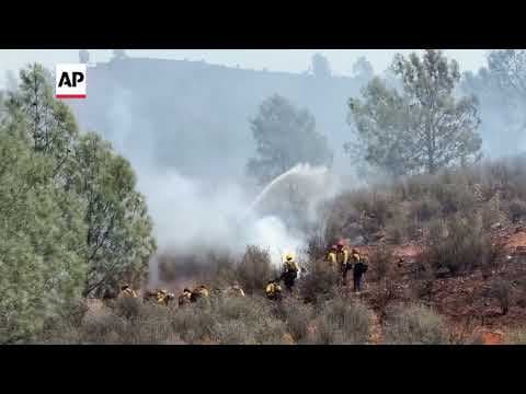 Firefighters battle wildfire devastating historic California town