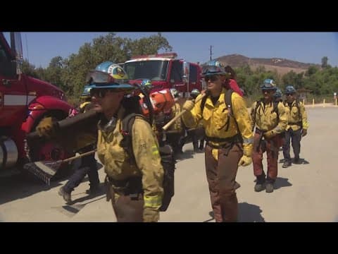 How heavy is the fire gear hand crews carry while fighting wildfires?
