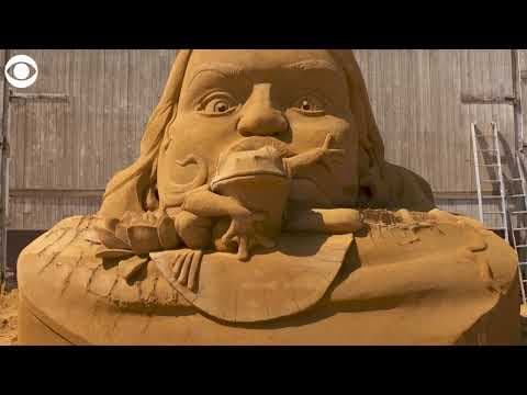 Giant sand sculptures depict fairy tale characters