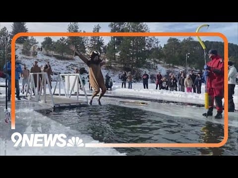 Hundred of people started the new year with a plunge into the frozen Evergreen Lake